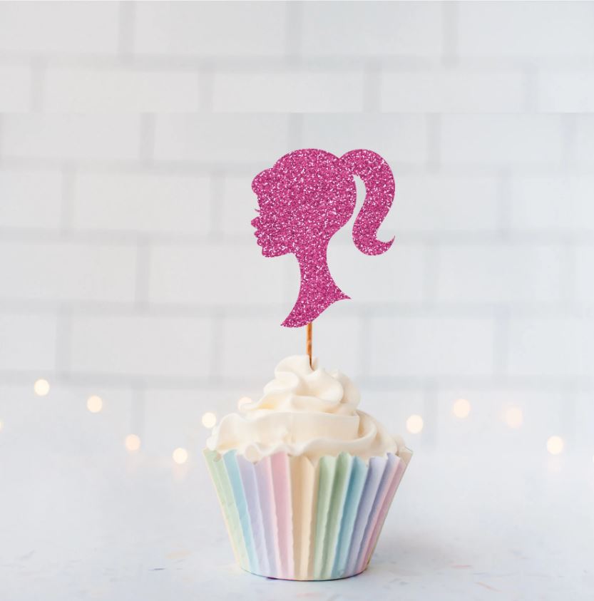 a cupcake with a pink silhouette on top of it